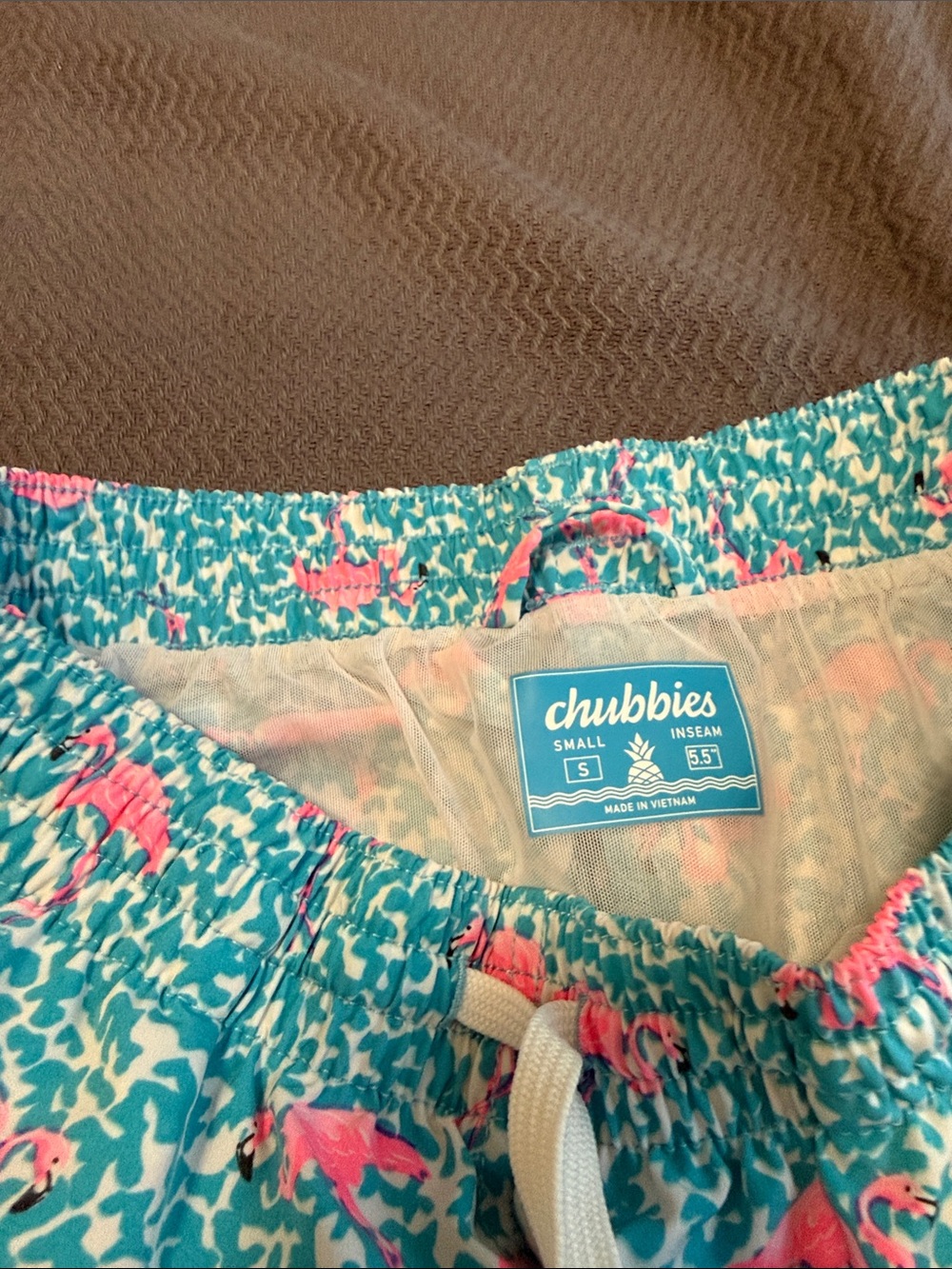 chubbies Teal Swim Shorts with Pink Flamingo Print.